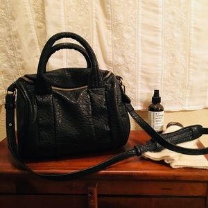 Black with gold studs over the shoulder/ arm bag